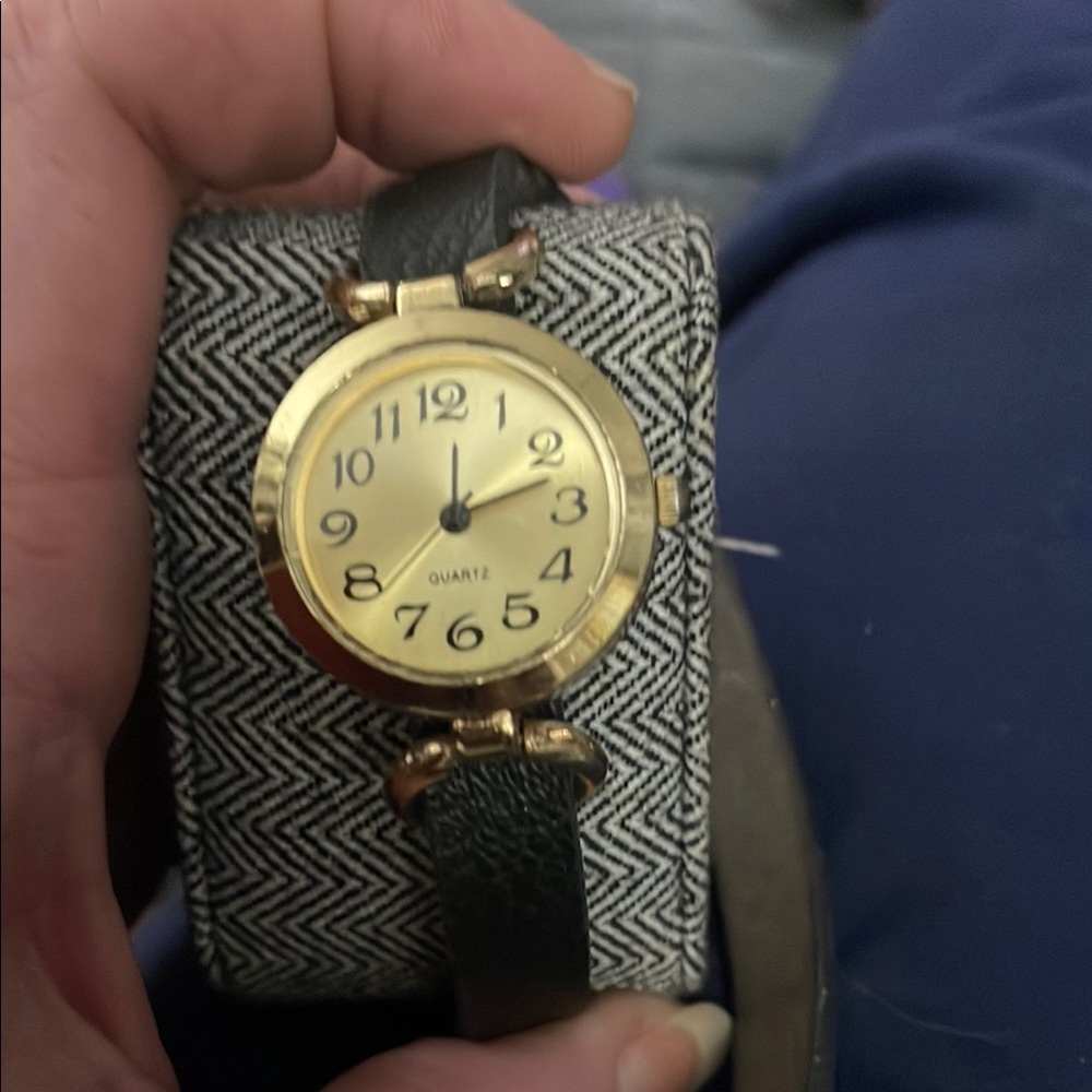 Gold and Black Vintage Watch with Round Face and Fabric Strap